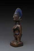 Ibegi female standing nude figure, carved wood and trade beads with blue painted hair, Yoruba tribe, Nigeria, ​25cm high