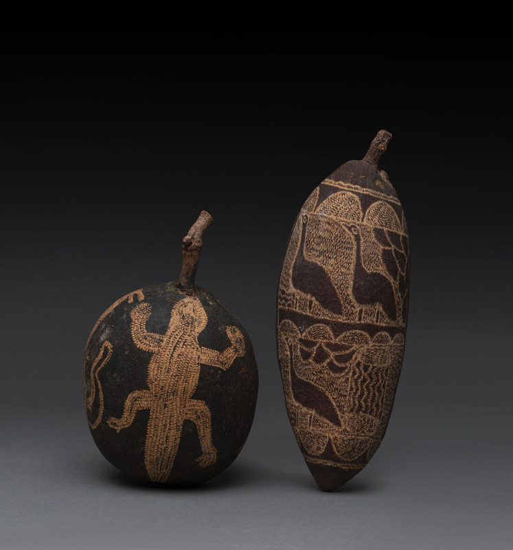 Two carved boab nuts (one damaged), Western Australian origin, 20th century, ​24cm and 17cm high