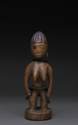 Ibegi female standing nude figure, carved wood, metal earring, trade beads with blue painted hair, Yoruba tribe, Nigeria, ​23cm high