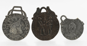 Three English Medieval style pilgrim medallions, two lead, one bronze, 19th century, ​the largest 11.5cm high