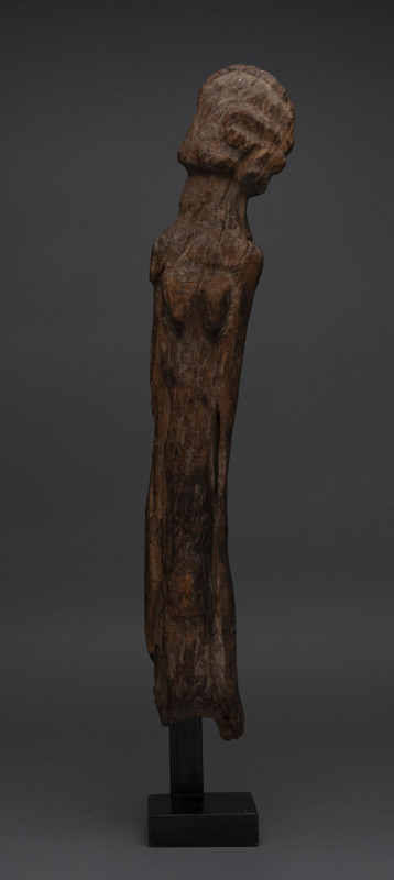 A standing figure (torso and head), carved wood, Dogon tribe, Mali, 59cm high