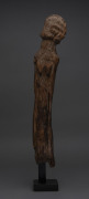 A standing figure (torso and head), carved wood, Dogon tribe, Mali, 59cm high