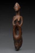 A horned mask with female figure, carved wood, Senufo tribe, Ivory Coast, ​65cm high