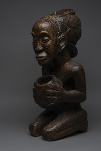 Kneeling figure with begging bowl in the long face style, carved wood, Baluba tribe, Congo, 62cm high