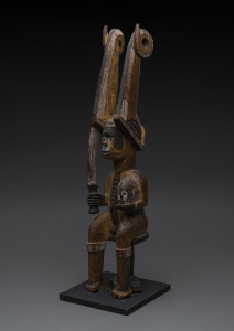 Ikenga figure with horned head dress, carved wood with earth pigments, Ibo tribe, Nigeria, on later wooden base, 58cm high