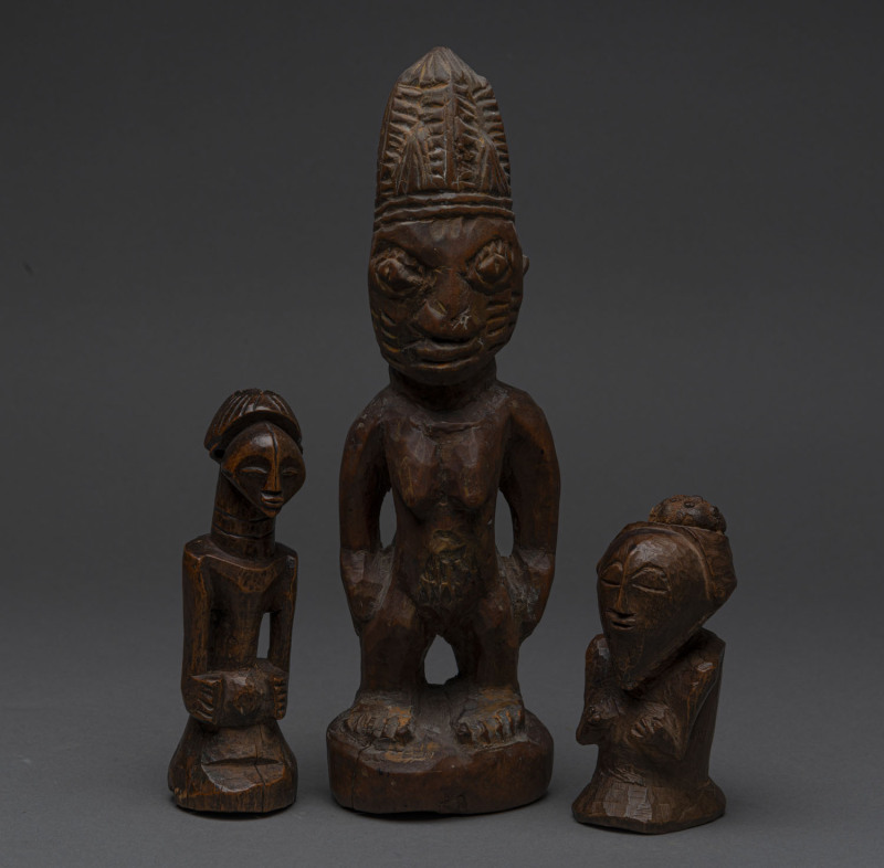 Three figures, carved wood with remains of ochre, Yoruba, Baluba and Bakongo tribes, Nigeria and Congo, 24cm, 13cm and 11cm high