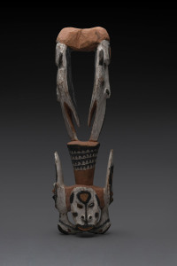A food hook, carved wood and shells with earth pigment decoration, Papua New Guinea, ​61cm high