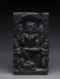 An antique Indian Hindu statue, carved wood with painted finish and remains of inscription, 19th century or earlier, 51cm high