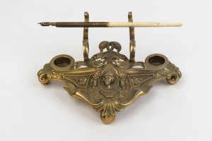 A French desk set, cast and gilt metal with pen, 19th century, ​19cm wide