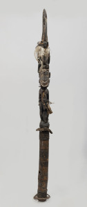 A figural flute stopper with bird totem, carved wood, feather, fibre, shell, hair and earth pigments, Papua New Guinea, ​135cm high