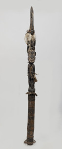 A figural flute stopper with bird totem, carved wood, feather, fibre, shell, hair and earth pigments, Papua New Guinea, 135cm high