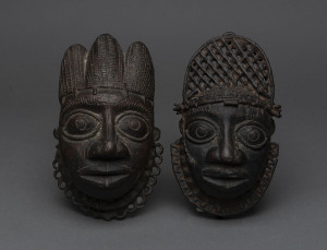 Two tribal face masks, cast bronze, West African, 18cm high