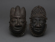 Two tribal face masks, cast bronze, West African, ​18cm high