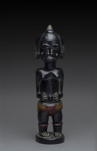 A standing female figure with braided hair, carved wood with black and polychrome finish, Baule tribe, Ivory Coast, 41cm high