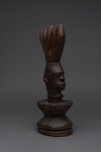 A male warrior bust with crested head dress, carved wood, Ibo tribe, Nigeria, 36cm high