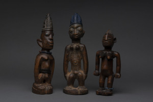 Three Ibegi statues, carved wood, beads and metal with remains of polychrome finish, Yoruba tribe, Nigeria, 28cm, 27cm and 22cm high