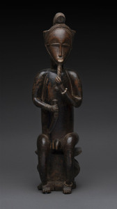 Seated male figure holdings his beard, carved wood and trade bead with remains of painted finish, Baule tribe, Ivory Coast, 53cm high