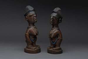 Two female Ibegi statues, carved wood, beads and fibre with remains of painted finish, Senufo tribe Ivory Coast, 24cm high