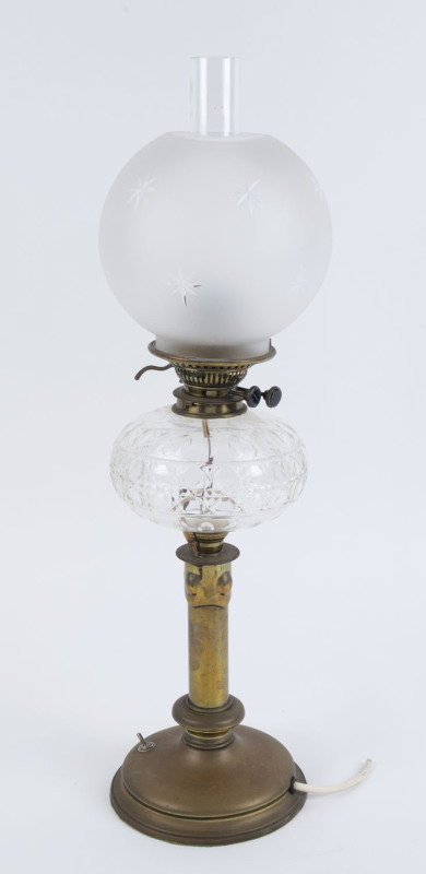 An antique oil lamp, brass base and column with hobnail crystal font, black button double burner and glass chimney (shade replaced), has been electrified (cord cut), ​75cm high overall