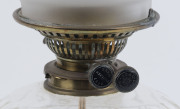 An antique oil lamp, brass base and column with hobnail crystal font, black button double burner and glass chimney (shade replaced), has been electrified (cord cut), ​75cm high overall - 2