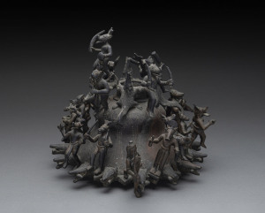 An unusual heavy cast bronze pot adorned with numerous crocodiles and animal demons in dancing, feasting and offering poses, 19th/20th century, 27cm high, 30cm wide