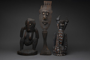 Three tribal artefacts, carved wood, shell and earth pigments, Papua New Guinea, ​the largest 64cm high