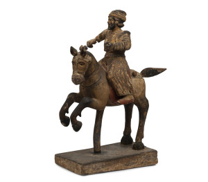 A horse and rider statue, carved wood with polychrome finish, possibly Spanish, 18th/19th century, 63cm high, 50 cm wide, 22cm deep
