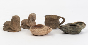 Two oil lamps, two sphinx seals and a cup, 1st century A.D. and later, the cup 9cm wide
