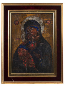 An antique Russian or Balkan icon, depicting The Vladimir Mother of God, painted on wood panel, early 19th century, later frame and mounting, 38 x 26cm