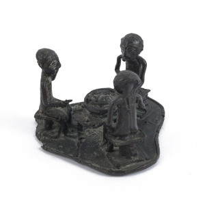 A sculpture of three seated figures, cast bronze, Ashanti tribe, Ghana, 6.5cm high, 8cm wide