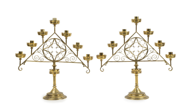 A pair of antique Gothic seven branch brass candelabra, 19th century, ​53cm high, 51cm wide