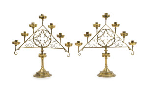 A pair of antique Gothic seven branch brass candelabra, 19th century, ​53cm high, 51cm wide