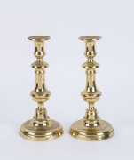 A pair of antique brass candlesticks, 19th century, ​25cm high