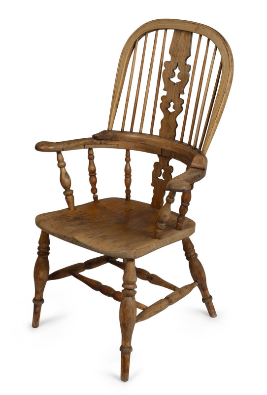 An antique English high back Windsor armchair, elm and beech with faded finish, early 19th century, ​110cm high, 71cm across the arms