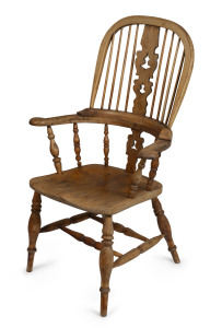 An antique English high back Windsor armchair, elm and beech with faded finish, early 19th century, 110cm high, 71cm across the arms