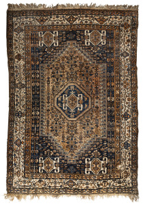 A Persian brown and blue hand-woven rug, 20th century, 310 x 212cm