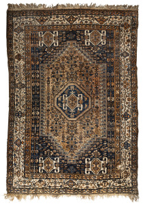A Persian brown and blue hand-woven rug, 20th century, ​310 x 212cm