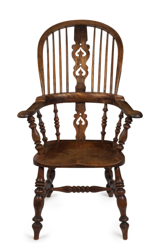 An English antique Windsor armchair, elm and beech, 19th century, 111cm high, 67cm across the arms