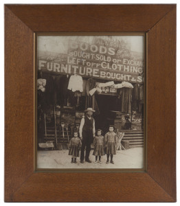 Two framed photographs of the Greenberg family business in Melbourne over two generations, ​64 x 54cm overall