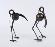 Two metal scissor head bird sculptures with bead tassel decoration, late 20th century, ​23cm and 21cm high