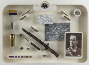 An ALBERT JACKA, VC TRIBUTE An attractively mounted and framed display of army badges, ribbons and buttons combined with battlefield finds - bullet cases, a bayonet, trench art and a 9ct gold and pearl "MOTHER/A.I.F." boomerang brooch, together with a pho - 4