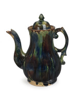 BENDIGO POTTERY Colonial coffee pot and cover with bold mottled green, blue and brown glaze, circa 1880, extremely rare.A less striking and the only other known example is housed by the National Gallery of Australia (purchased in 1988).26cm high