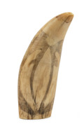 A scrimshaw whale's tooth decorated with Pacific Islander figures blowing conch horns, 17cm high