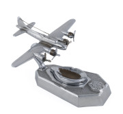 An R.A.A.F. chrome aeroplane desk ashtray ornament, circa 1940s, 18cm high, 30cm long