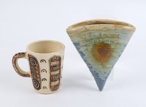 REMUED (attributed) pottery wall pocket and a pottery mug with Aboriginal decoration, (2 items), the pocket vase15cm high