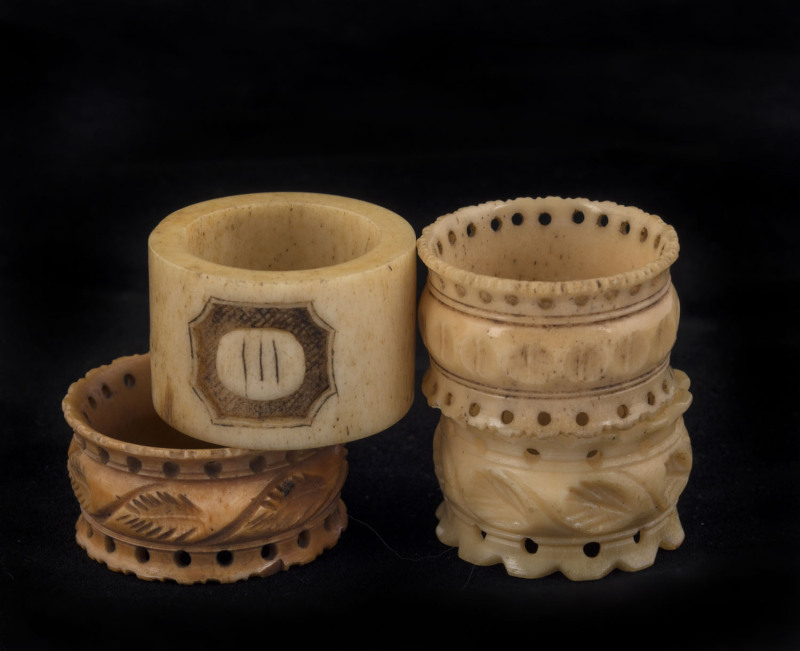 Four assorted whalebone napkin rings, early to mid 19th century, ​the largest 4cm diameter