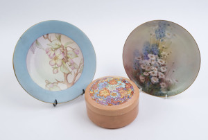 M. ARMSTRONG hand-painted porcelain plate and circular jewellery box, plus E.M. BURROWS (1920) hand-painted porcelain plate, (3 items), the larger plate 23.5cm diameter