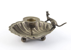 A silver plated candle holder with kangaroo handle, circa 1900, ​8cm high, 15cm wide
