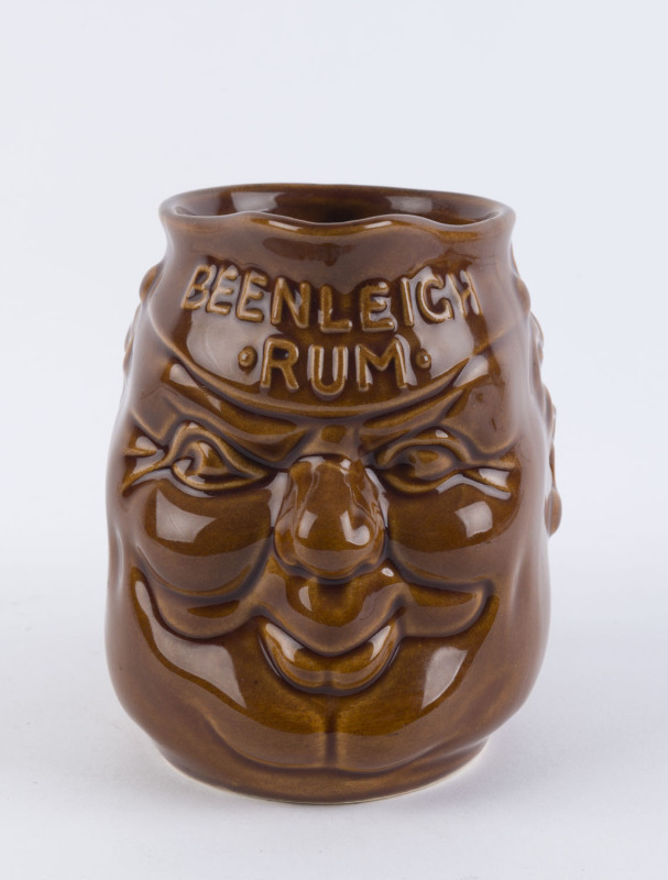 BEENLEIGH RUM brown glaze pottery character jug, incised "Elischer, Australia" 14cm high 17cm wide