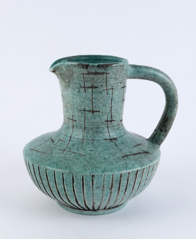 TOM SANDERS green glazed pottery jug, incised "T. O. Sanders, 1961", 17cm high, 19cm wide